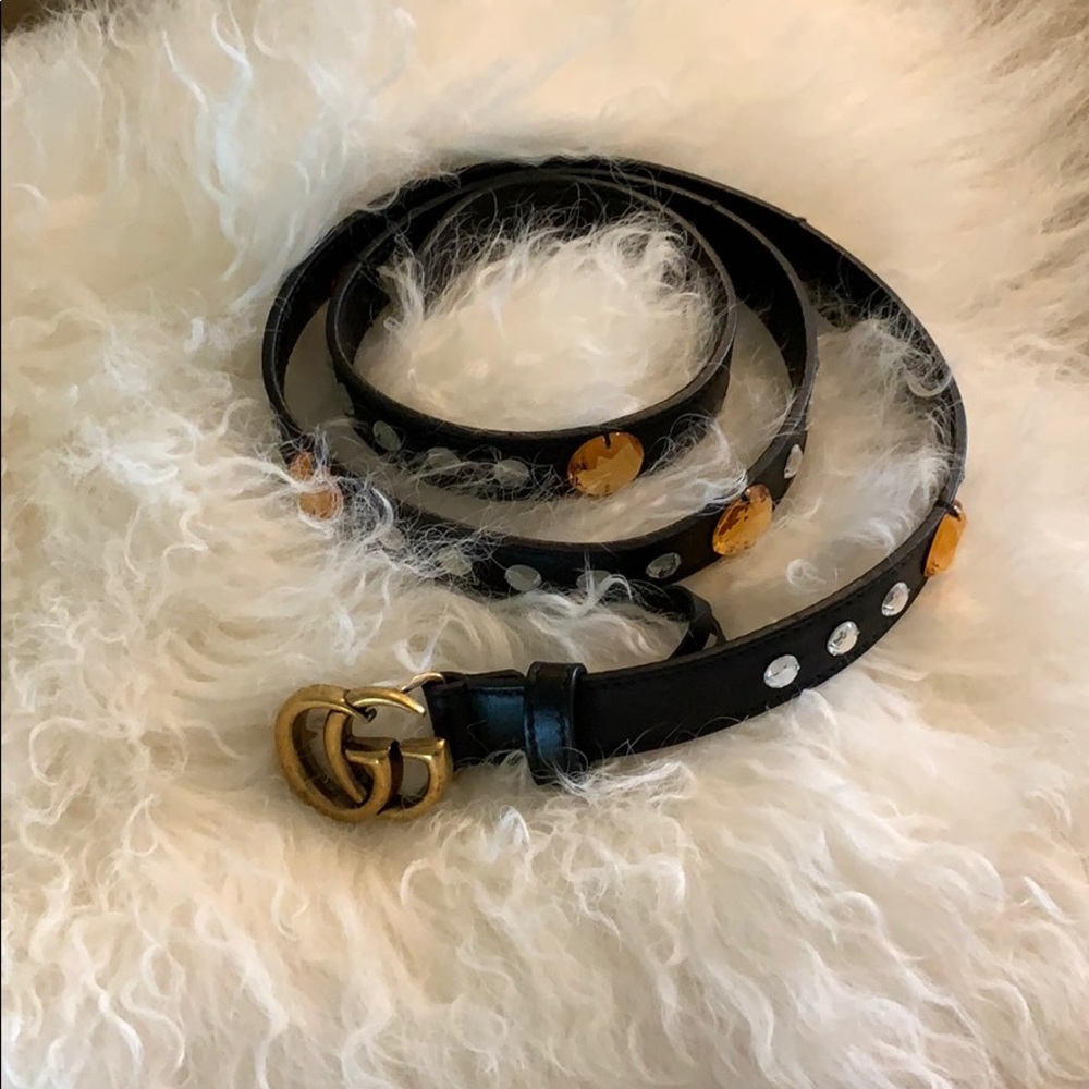 Gucci belt with embellishments.